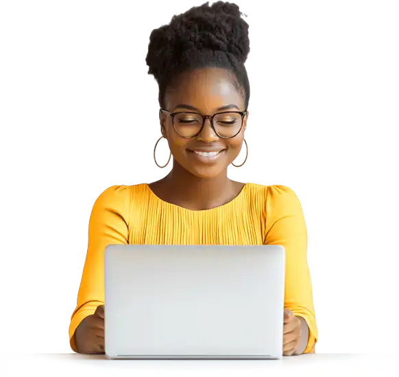 Homepage 9 A woman in glasses is smiling while using a laptop.