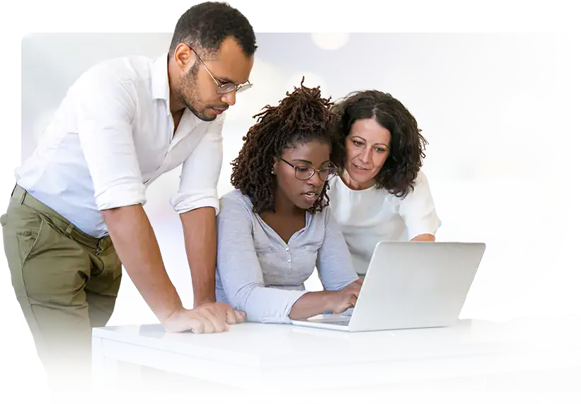 group of people looking at laptop