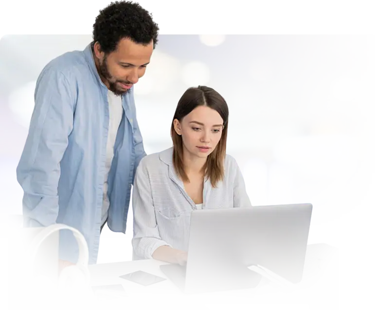 man and woman looking at laptop