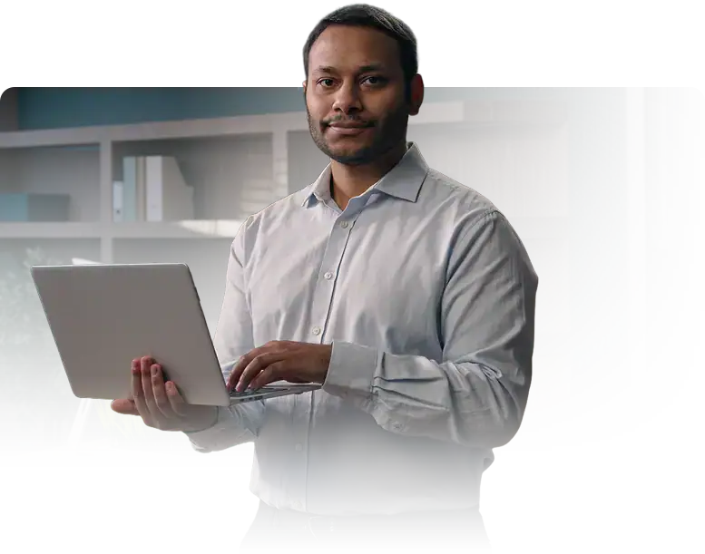 office worker standing with laptop